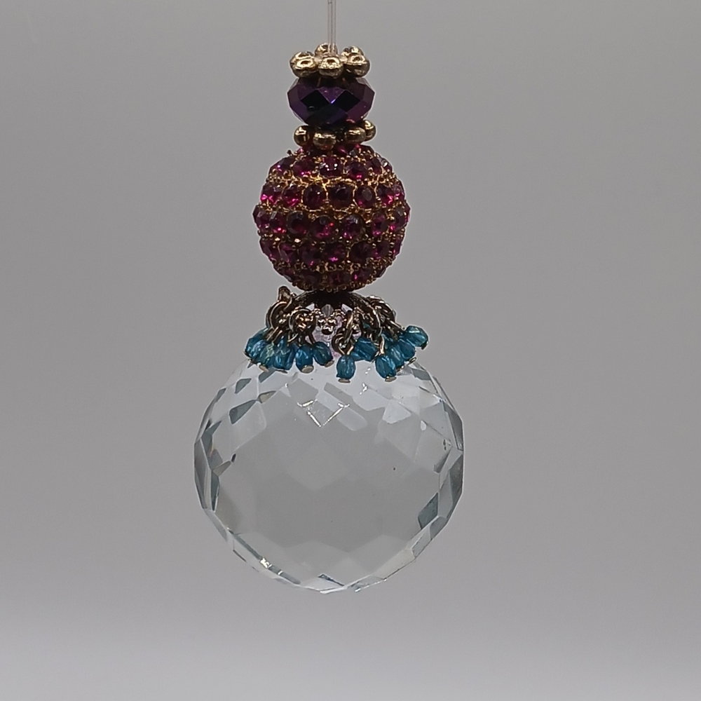 Elegant Crystal Pendant with Purple and Blue Accents